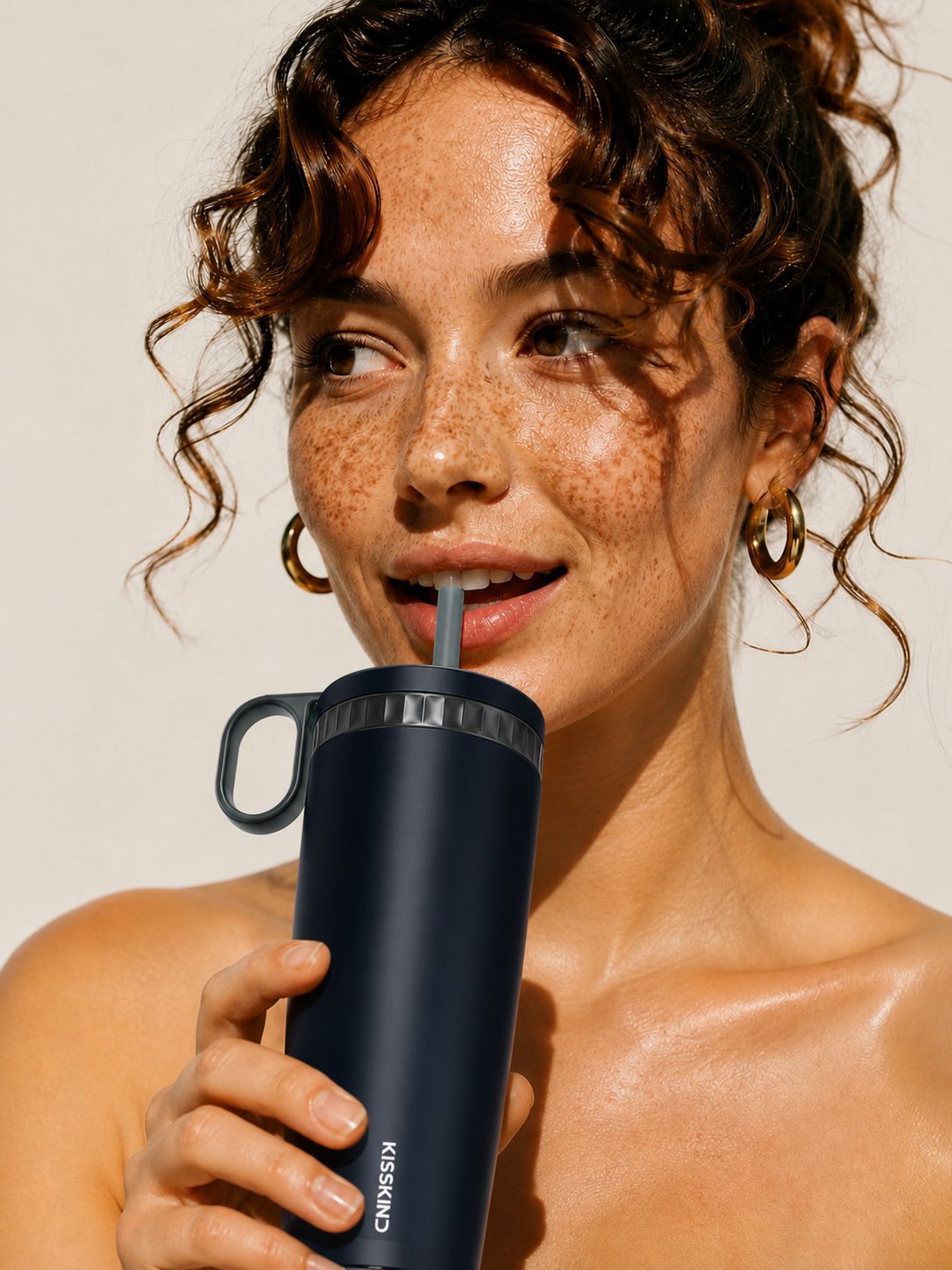 Drinking from the hidden straw of the Kisskind tumbler